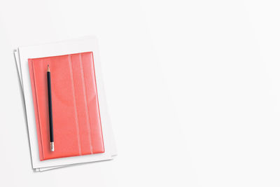 High angle view of open book against white background