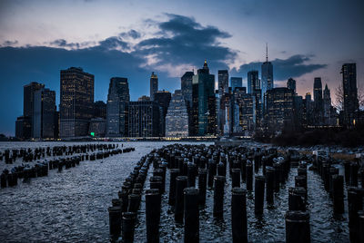 Panoramic view of modern buildings in city against sky