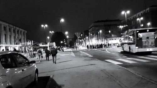 Cars on city street at night