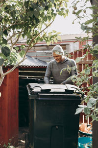 Full length of man standing in yard