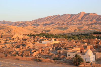 Ancient ruins against mountain range