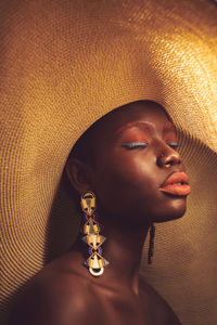Close-up of woman wearing hat