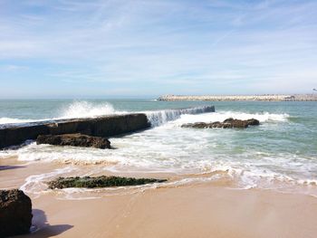 Scenic view of beach against sky