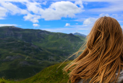 Rear view of woman against mountains