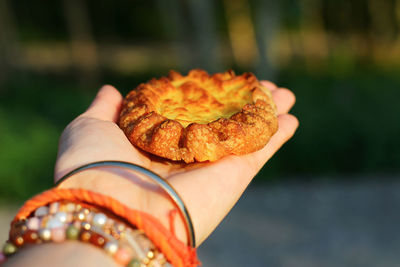 Close-up of hand holding bread