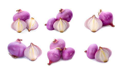 Close-up of grapes over white background