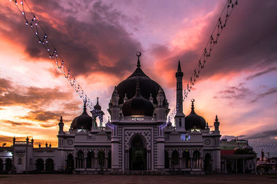 Church against cloudy sky during sunset