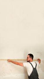 Portrait of young man standing on snow