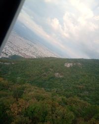 Scenic view of landscape and mountains against sky