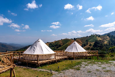 Tent on field against sky