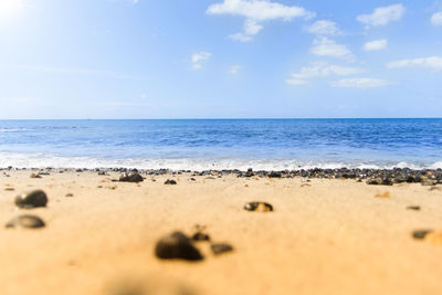 Surface level of beach against sky