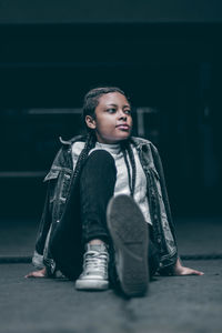 Girl sitting on floor