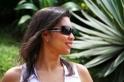 Close-up of beautiful young woman wearing sunglasses