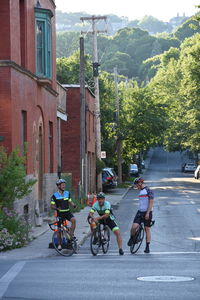 Bicycles on road by buildings in city