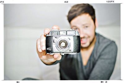 Photographer photographing through camera