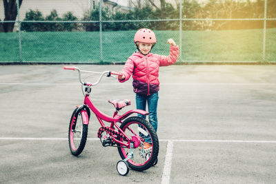 Portrait of girl riding bicycle