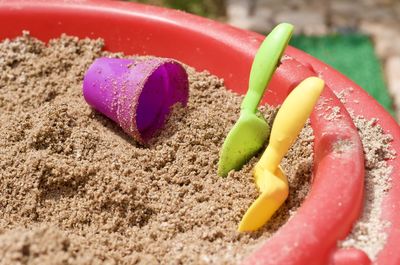 Close-up of multi colored candies on sand