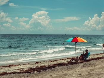 Scenic view of beach against sky