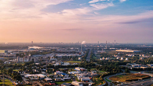 High angle view of city buildings during sunset