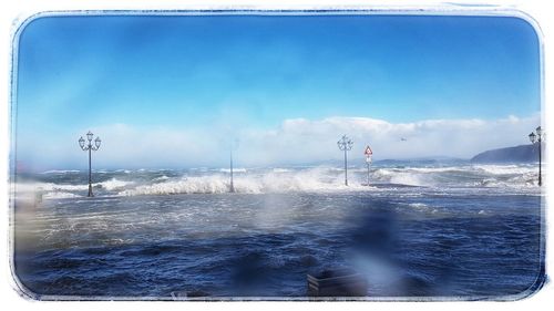 Scenic view of sea against blue sky