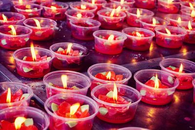 Close-up of illuminated tea light candles