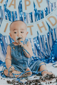 Portrait of cute girl blowing bubbles