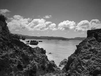 Scenic view of sea against cloudy sky