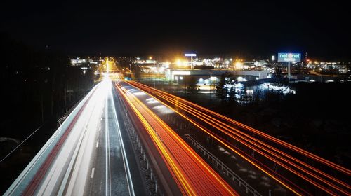 High angle view of light trails on road at night