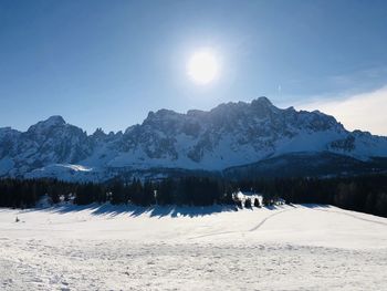 Scenic view of snow covered mountains against sky