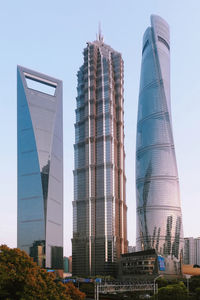 Low angle view of modern buildings against sky