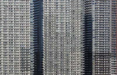 Dense urban living in a row of skyscrapers in tokyo, japan