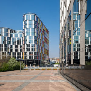 View of modern buildings of the european parliament against blue sky