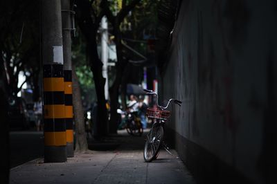 Bicycle parked on street in city
