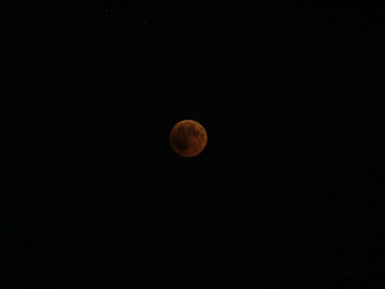 Low angle view of moon against sky at night