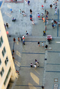 High angle view of people walking on city street