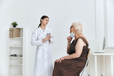 Woman standing on the wall