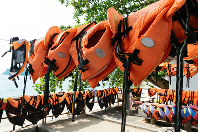 Group of people in row against orange sky