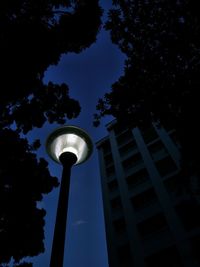 Low angle view of communications tower against sky