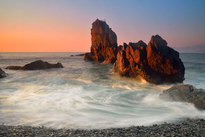 Scenic view of sea at sunset