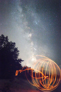 Scenic view of star field against sky at night