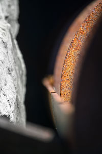 Close-up of burning candles on wood