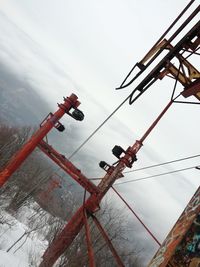 Low angle view of cables against sky