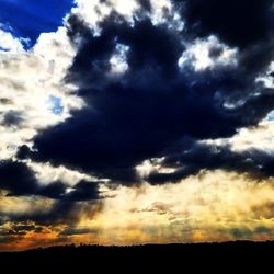 Low angle view of dramatic sky during sunset