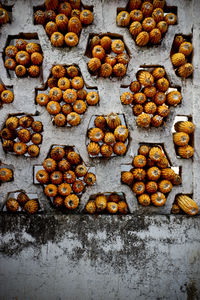 Sweetcorns stuck in holes on wall