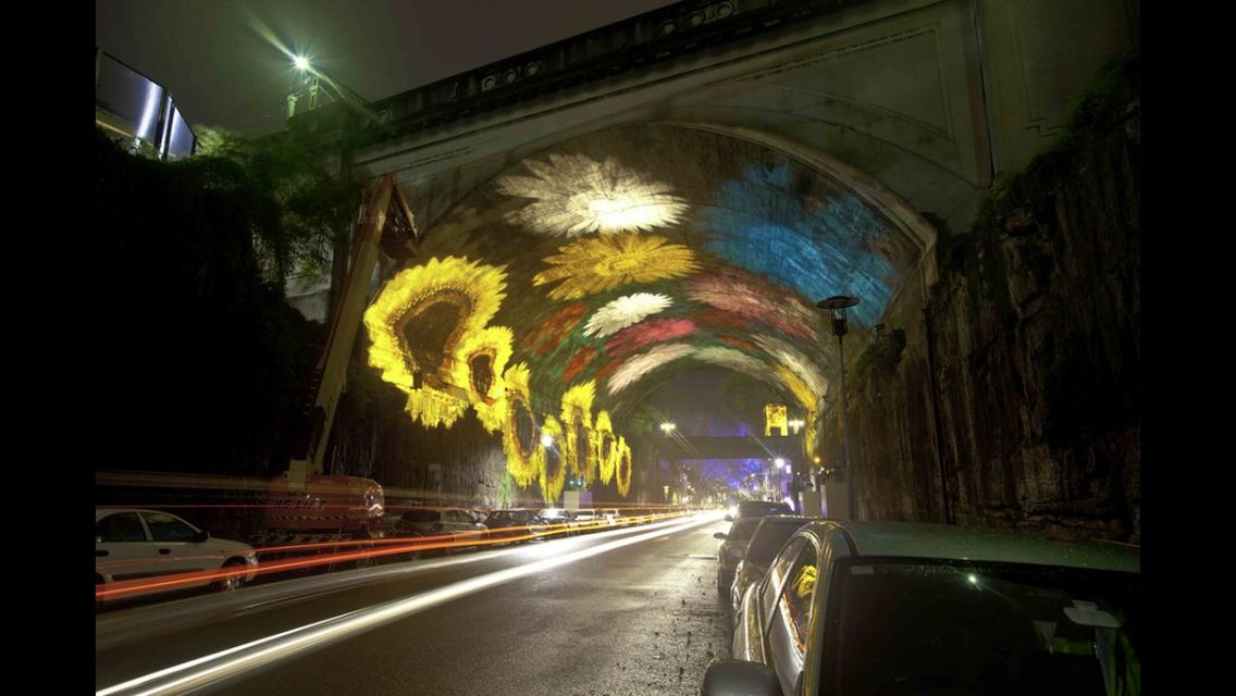 illuminated, night, transportation, architecture, built structure, road, street, light trail, car, land vehicle, the way forward, building exterior, long exposure, city, mode of transport, motion, arch, tunnel, lighting equipment, blurred motion