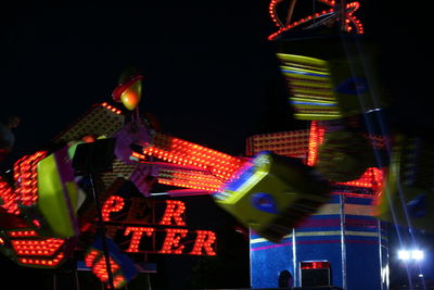 Low angle view of illuminated ferris wheel