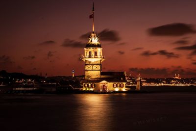 Illuminated building against sky at night