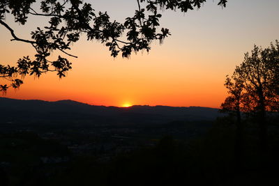 Scenic view of silhouette landscape against romantic sky at sunset