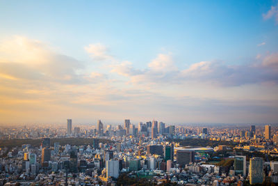 Aerial view of city buildings against sky