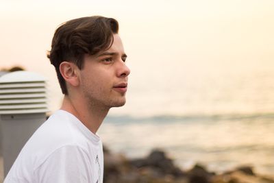 Close-up of young man at beach